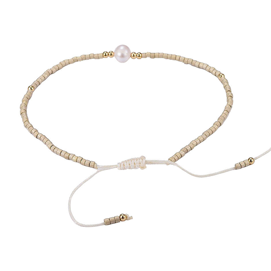 Wit zoetwater parel armbandje met creme kleurige kraaltje achterzijde | Mini Pearl One Wheat Color