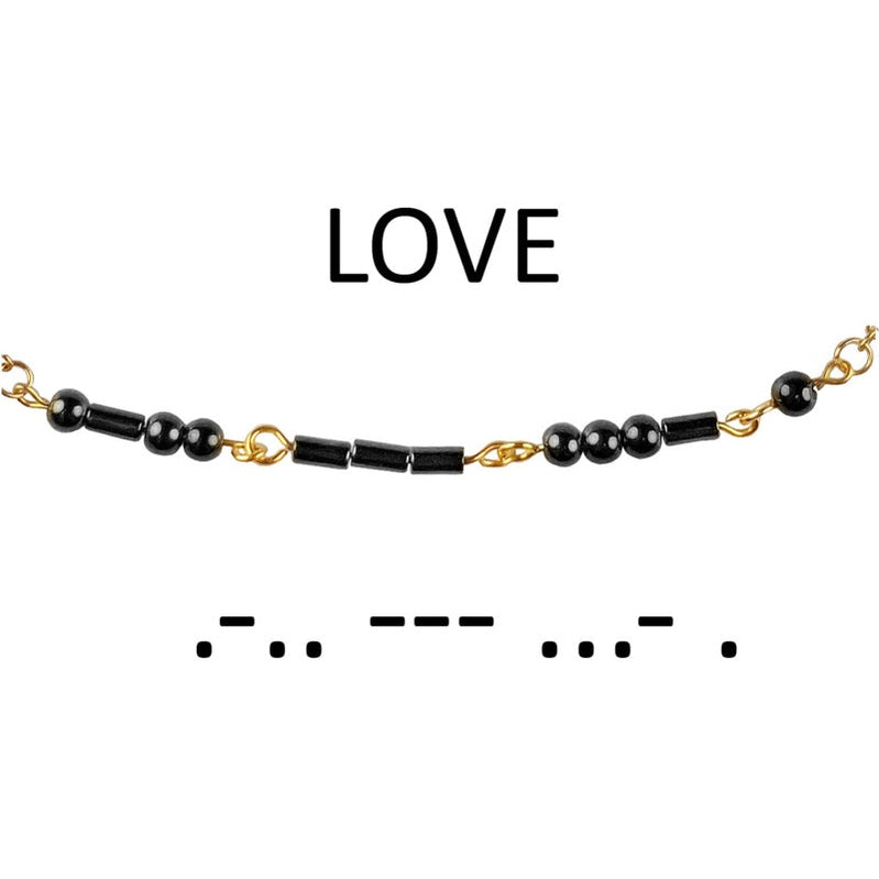 Detail van zwarte edelstenen ketting met goud edelstaal en hematiet stenen die het woord LOVE in morse code weer geeft | Morse Code Love Black Hematite Gold