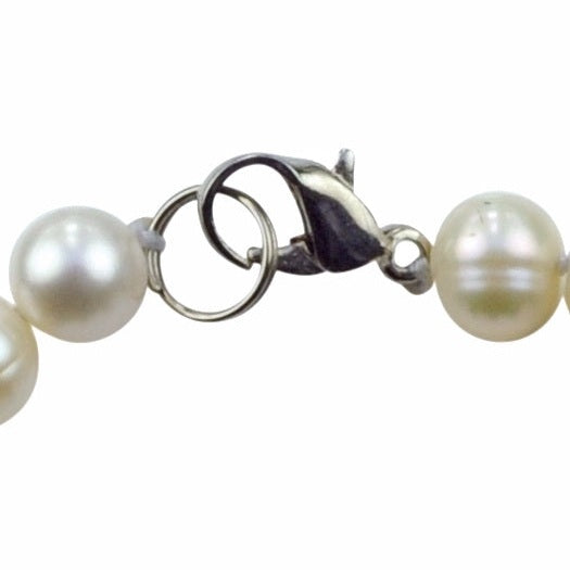 Slotje van wit handgeknoopt zoetwater parel armband met paarse kristallen en sterling zilver (925) | Pam