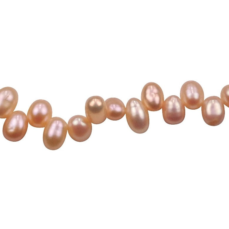 Detail van zoetwater parel armband met zalm kleurige parels en sterling zilver | Zamia