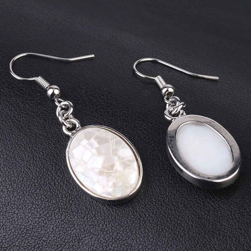 Witte ovale parelmoeren oorbellen met sterling zilver 925 voor en achterzijde | Oval White Shell Crackle