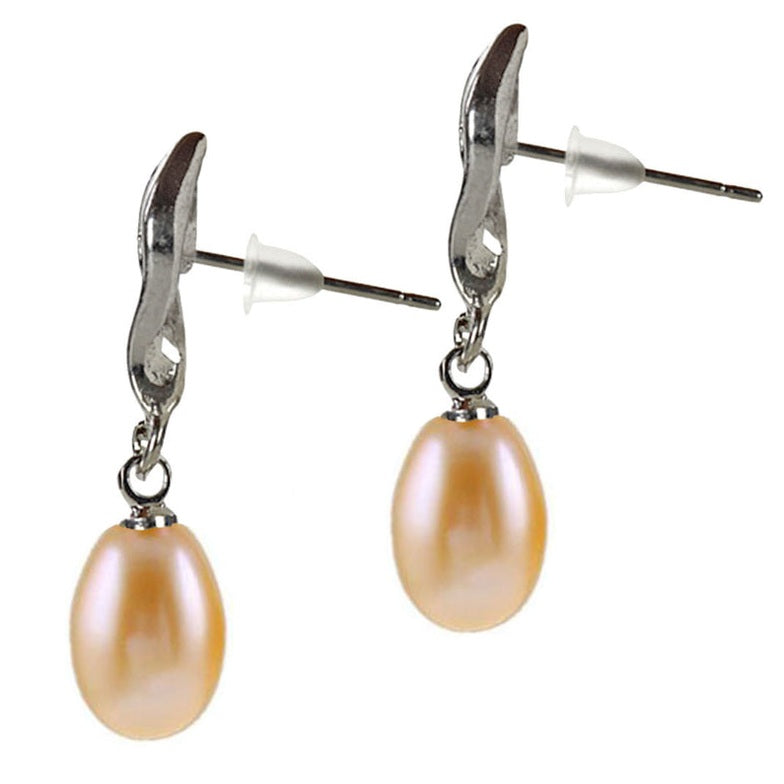 Zalm kleurige zoetwater parel oorbellen met stras steentje zijaanzicht | oorstekers Leza