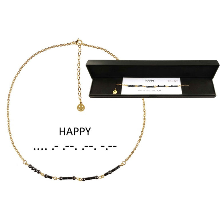 Zwarte edelstenen ketting met goud edelstaal en hematiet stenen die het woord HAPPY in morse code weer geeft in mooi sieradendoosje | Morse Code Happy Black Hematite Gold