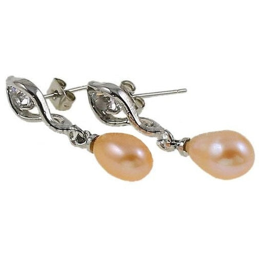 Zalm kleurige zoetwater parel oorbellen met stras steentje liggend | oorstekers Leza