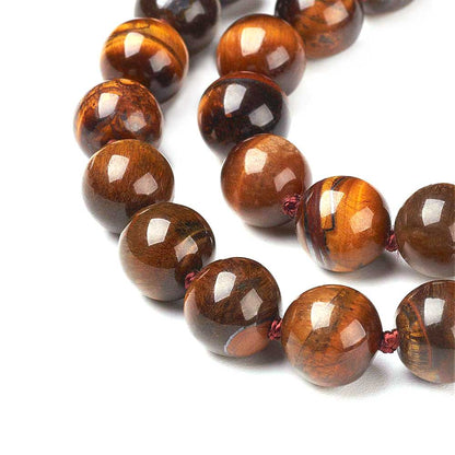 Detail van bruine handgeknoopte edelstenen ketting met tijgeroog en sterling zilver (925) | Tiger Eye Ball