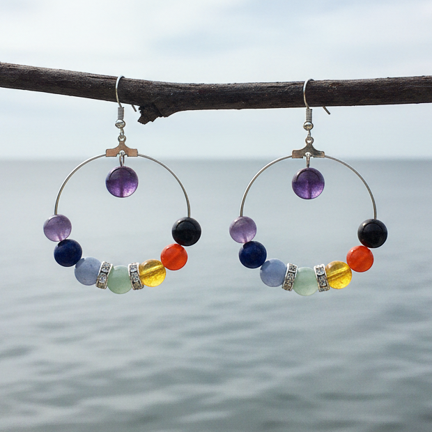 Edelstenen oorbellen in de kleuren van de verschillende chakra&