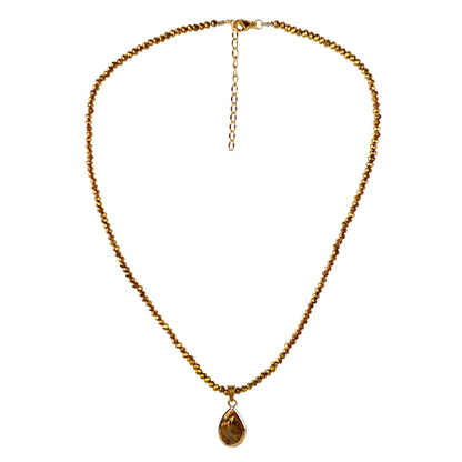 Bruine parelketting met edelstaal en gouden kristallen | set Badia