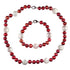 Handgeknoopt zoetwater parel set bestaande uit een parelketting en een parel armband met rode en witte parels | Ruby