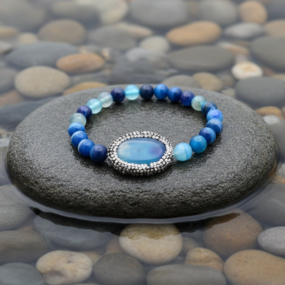 Bling Oval Blue Striped Agate armband - verbeterde versie op grijze natte steen