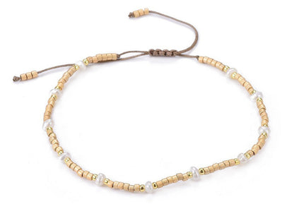 Wit zoetwater parel armband, schuifarmband, zijaanzicht | Mini Pearl Bead Gold