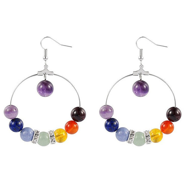 Edelstenen oorbellen in de kleuren van de verschillende chakra&