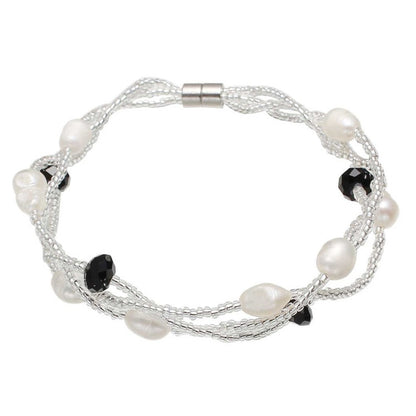 Wit zoetwater parel armband met zwart facet geslepen kristallen en magneetslotje, bovenaanzicht | Twine Pearl Black Crystal