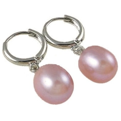 Zoetwater parel oorringen met roze parels en zilver edelstaal liggend | Pente