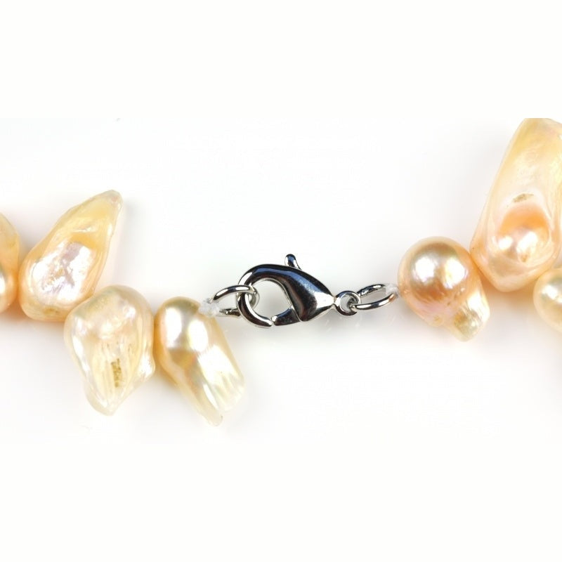 Slotje van zoetwater parelketting met zalm kleurige parels en sterling zilver (925) | Suzet