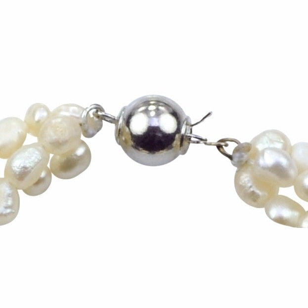 Slotje van zoetwaterparel armband met 3 rijen witte en paarse parels en veiligheidslotje | Branca
