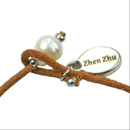 Slotje van wit zoetwater parel armband met leer | Ibiza Red