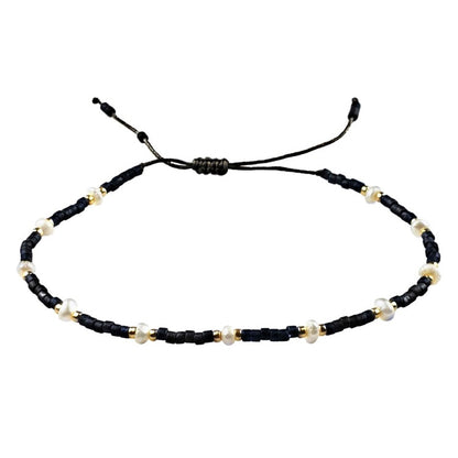 Wit zoetwater parel schuif armband met zwarte en gouden kraaltjes | Mini Pearl Bead Black