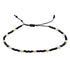 Wit zoetwater parel schuif armband met zwarte en gouden kraaltjes | Mini Pearl Bead Black