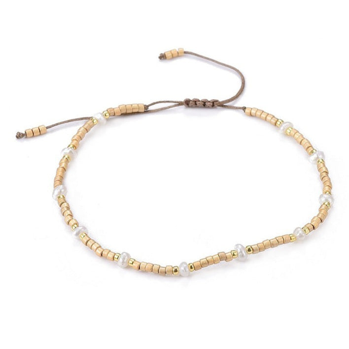 Wit zoetwater parel armband, schuifarmband, zijaanzicht | Mini Pearl Bead Gold