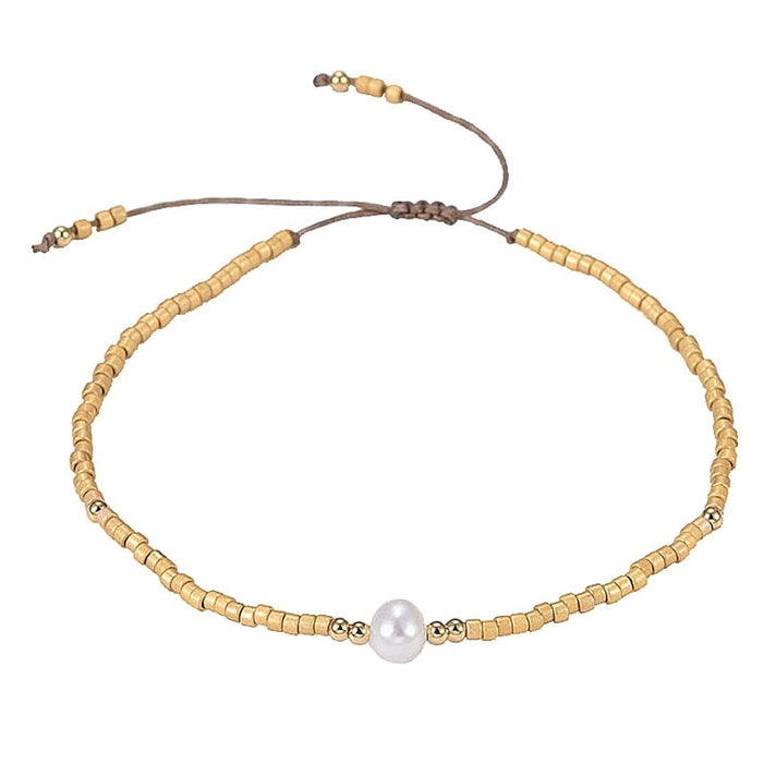 Wit zoetwater parel armband met gouden kraaltjes | Mini Pearl One Gold Color