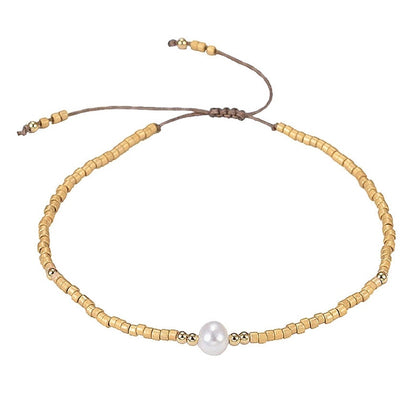 Wit zoetwater parel armband met gouden kraaltjes | Mini Pearl One Gold Color