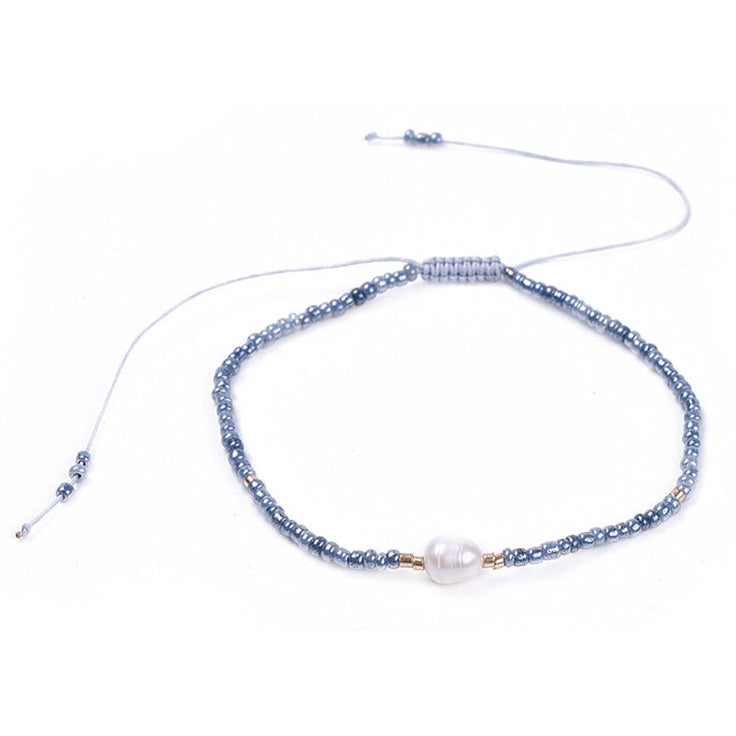 Wit zoetwater parel armband met licht blauwe kraaltjes | Mini Pearl One Shiny Light Blue
