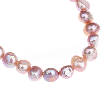 Detail van zalm roze zoetwater parel armband, elastisch | Shinny Pearl Pink
