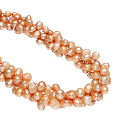 Detail van oranje zoetwater parelketting met 3 rijen parels | Azina