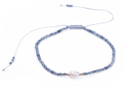 Wit zoetwater parel armband met licht blauwe kraaltjes | Mini Pearl One Shiny Light Blue