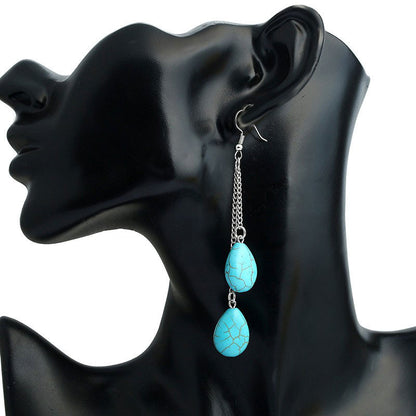 Lange edelstenen oorbellen met turkoois en sterling zilver (925) op display | Double Drop Turquoise